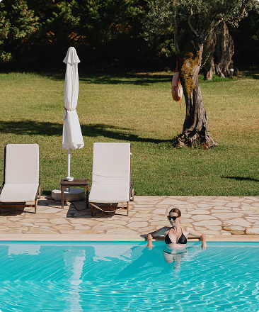 Woman relaxing in her private villa pool with Beach Please Tulum
